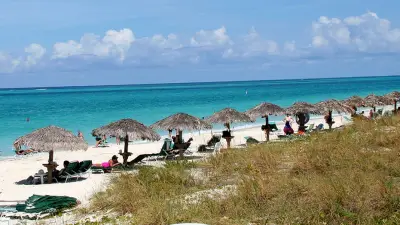 Mystery deepens as body discovered during search for missing American in island paradise